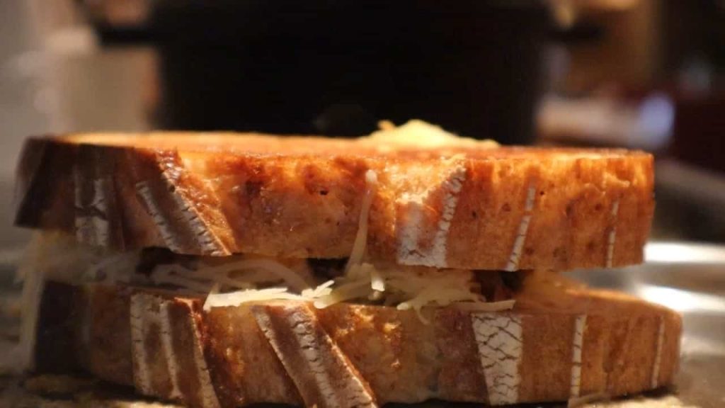 Close up of grilled cheese sandwich after being flipped