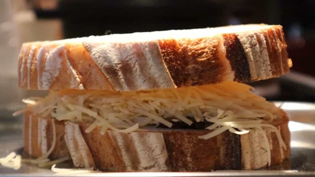 Close up of grilled cheese sandwich on griddle