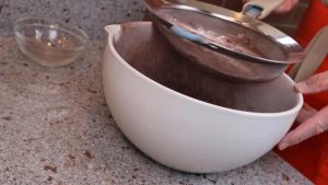 Sifting the flour and cocoa powder