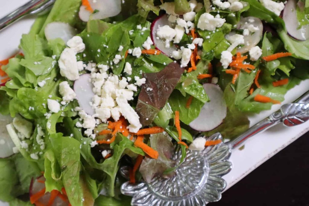 Salad dressed with spicy citrus and cumin vinaigrette.